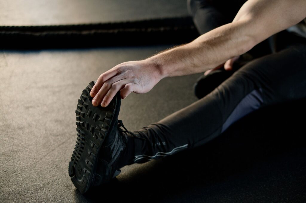 tennis stretching warm up - photo by Ivan S via Pexels